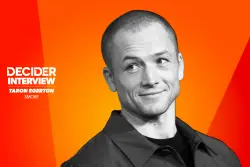 ‘Smoke’s Taron Egerton Praises Dennis Lehane’s Decision To Use Real Fire When Filming: “There’s Tremendous Value In Human Effort…I Would Argue It’s More Beautiful Than Were It Made By A Computer”